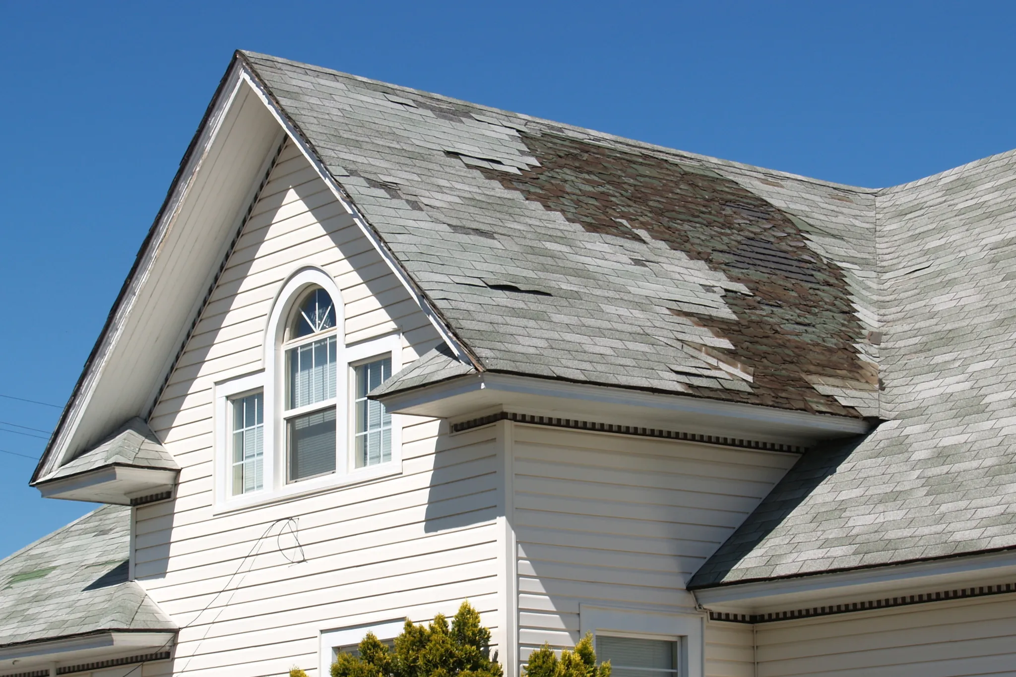 old roof repair replace white house damaged shingles